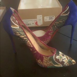 Louboutin heels, never worn, in original, size 40